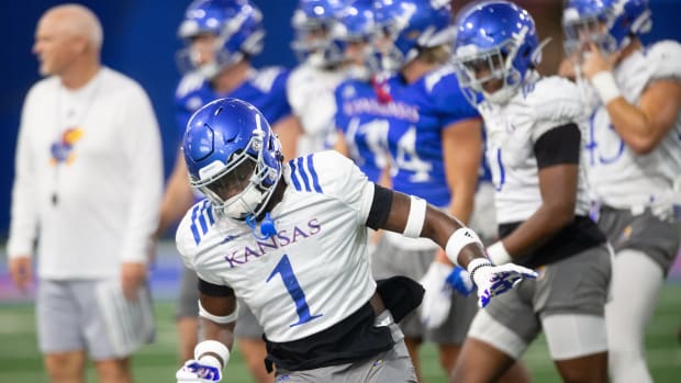 Kansas senior safety Kenny Logan Jr. (1) runs through drills during practice Friday evening at the indoor practice facility.